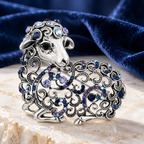 Vintage Openwork Jeweled Ram Brooch — styled background