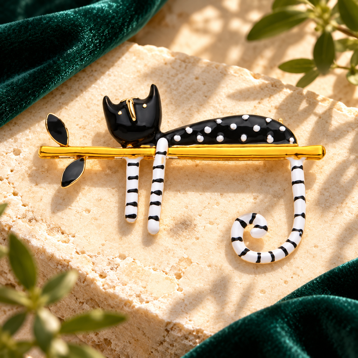 Black Enamel Cat Lounging on Branch Brooch — styled background