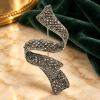 Vintage Jeweled Spiral Ribbon Brooch — styled background