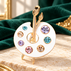 Enamel Artist Palette with Jeweled Paints Brooch — styled background
