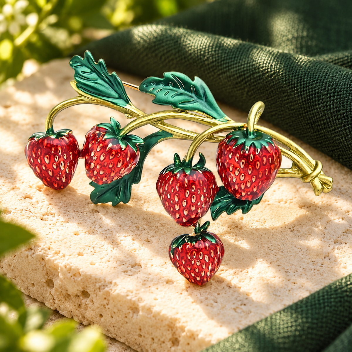 Red Strawberry Branch Brooch — styled background
