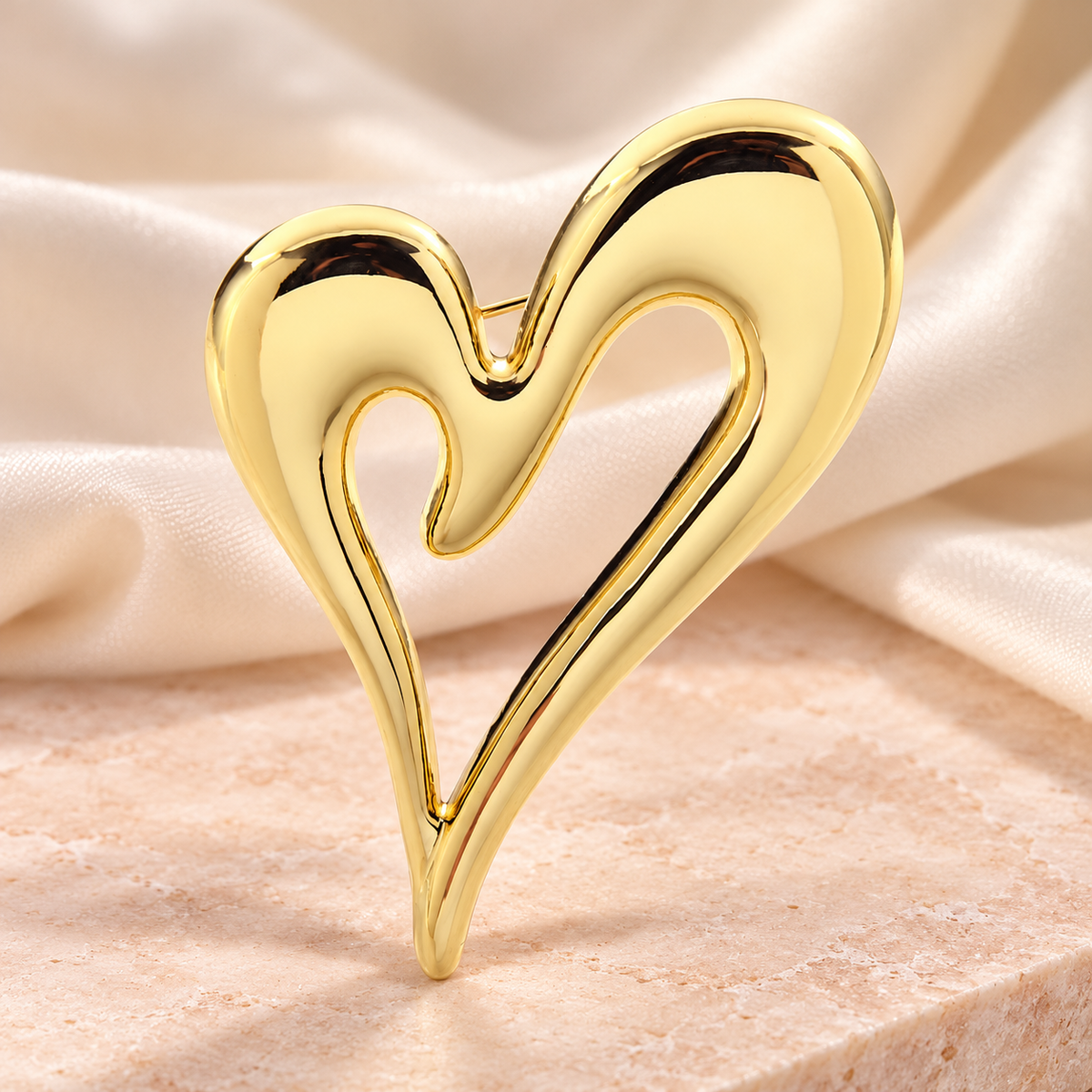 Sculpted Asymmetric Open Heart Brooch — styled background