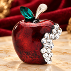 Red Enamel Jeweled Apple Brooch — styled background