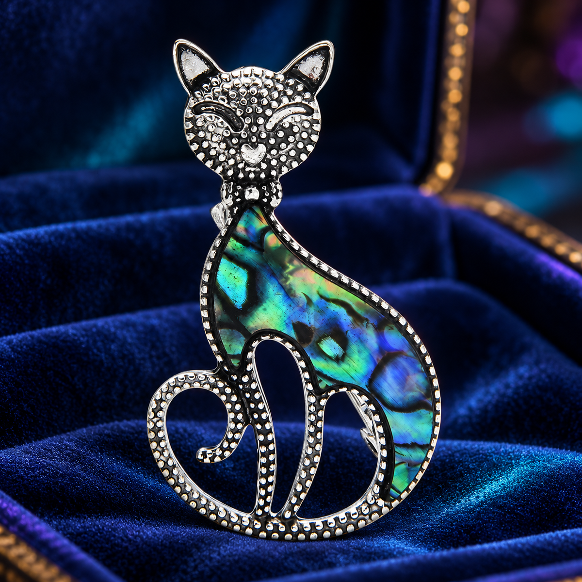 Iridescent Shell Cat Brooch — styled background