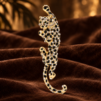 Jeweled Climbing Leopard Brooch — styled background