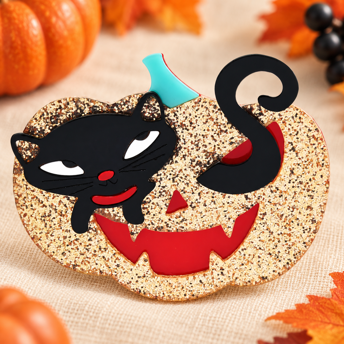 Glitter Cat in Pumpkin Acrylic Brooch — styled background