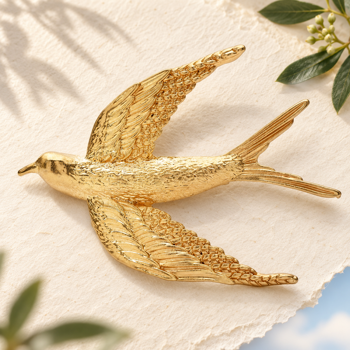Textured Flying Swallow Brooch — styled background