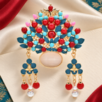 Ornate Floral Crown with Dangling Beads Brooch — styled background