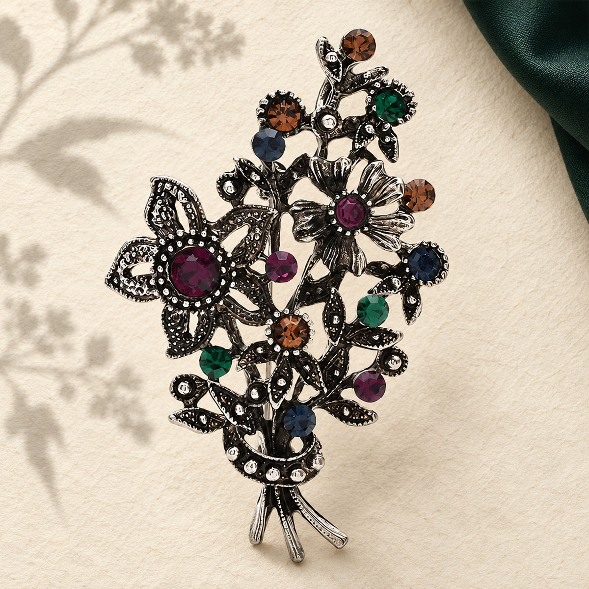 Vintage Jeweled Floral Bouquet Brooch — styled background