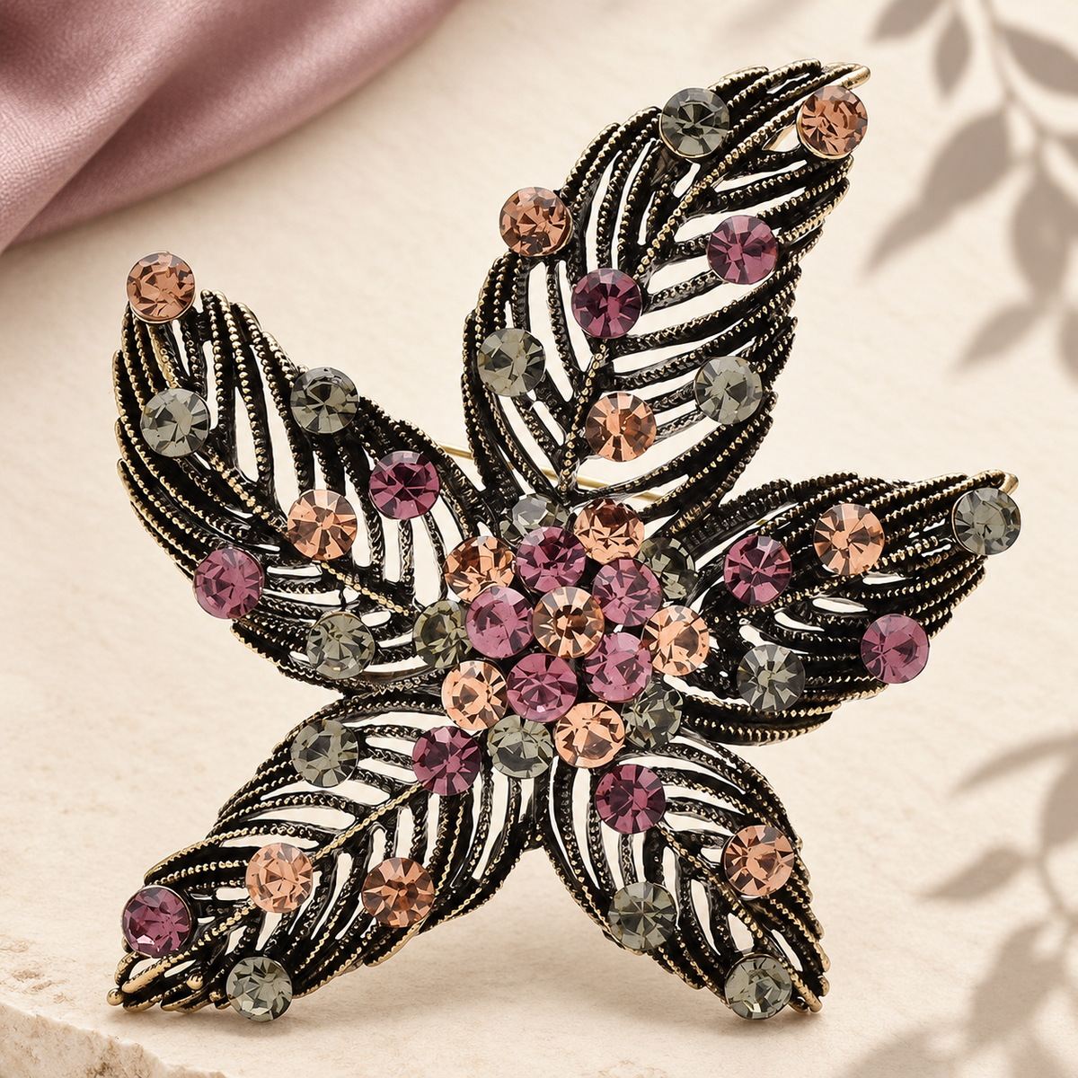 Textured Leaf Flower with Rhinestones Brooch — styled background