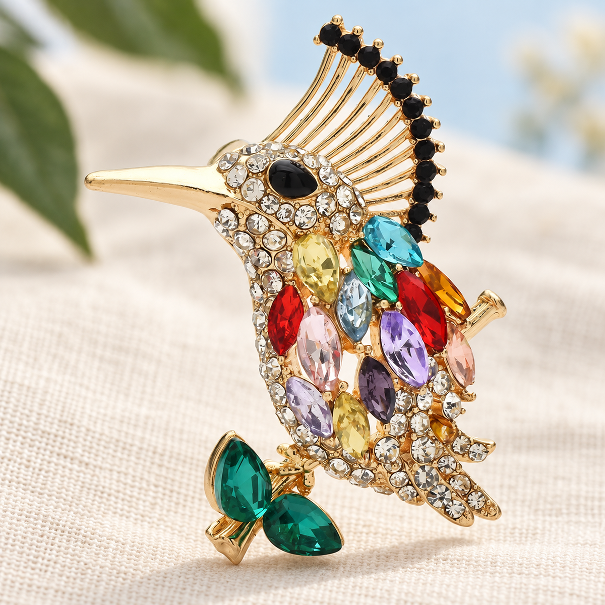 Crested Bird with Colorful Faceted Accents Brooch — styled background