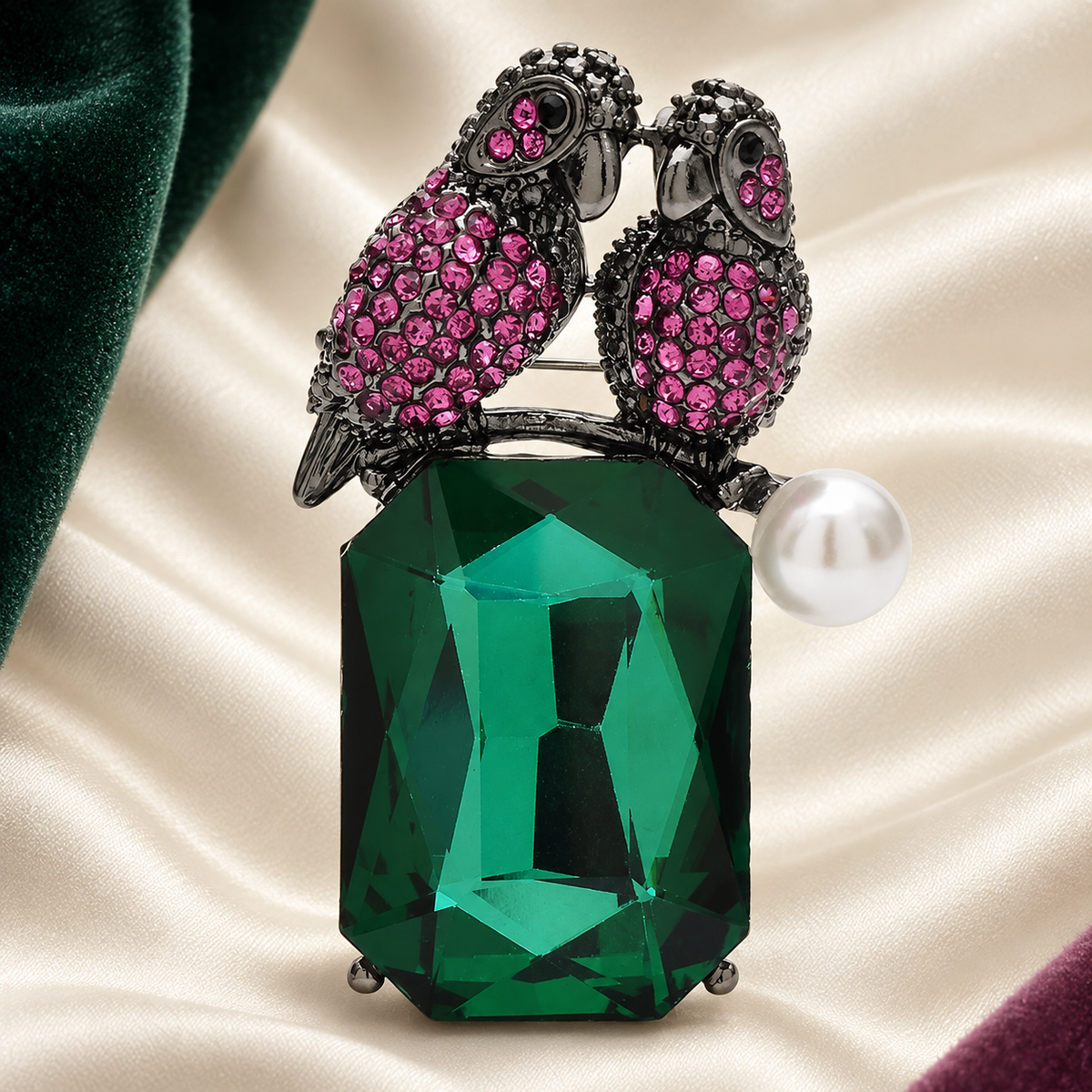 Jeweled Bird Pair on Faceted Drop Brooch — styled background