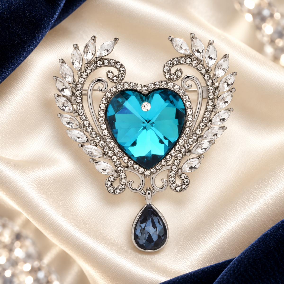 Faceted Heart with Laurel Frame and Drop Brooch — styled background