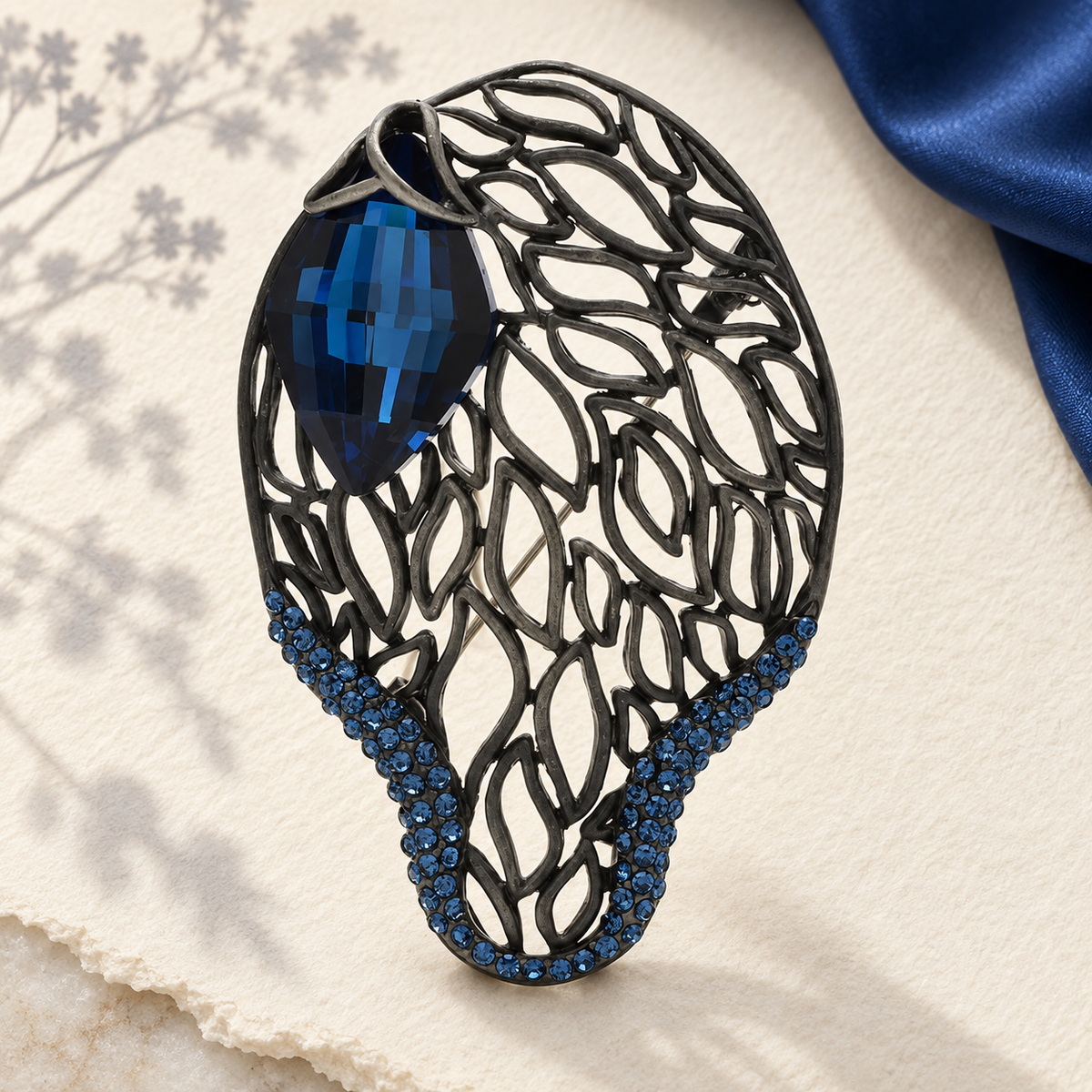 Openwork Leaf with Faceted Accent Brooch — styled background