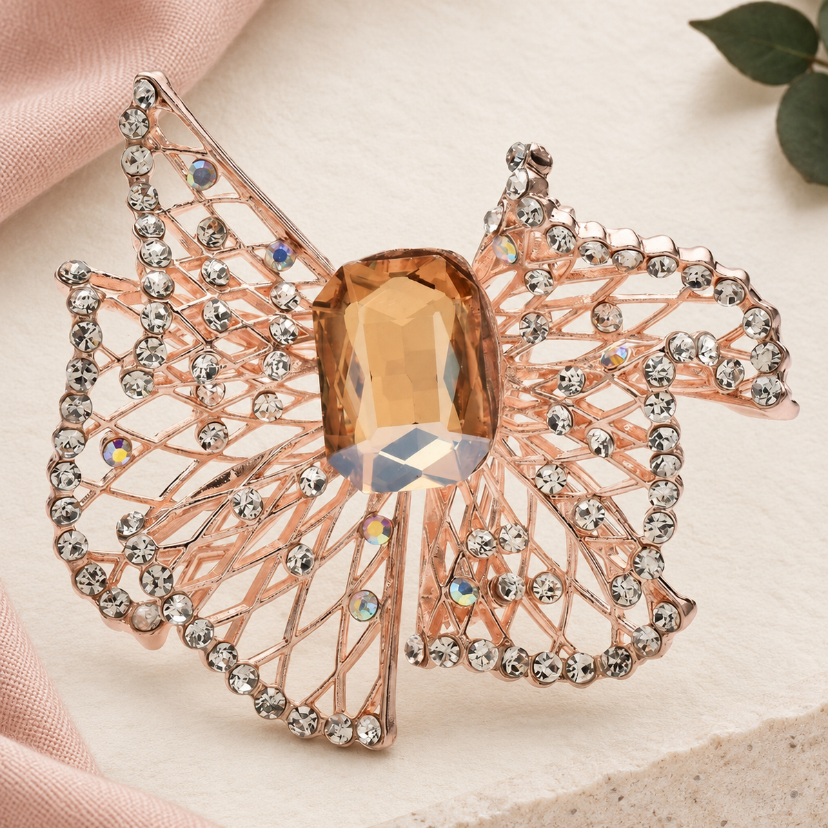 Openwork Geometric Frame with Faceted Center Brooch — styled background