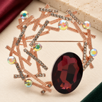 Geometric Branch Wreath with Faceted Oval Brooch — styled background