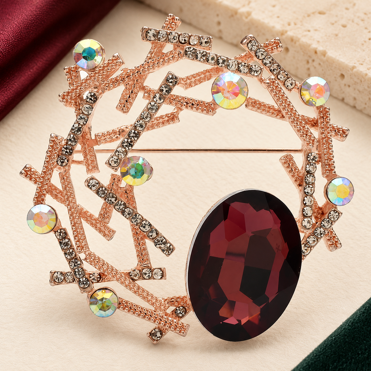 Geometric Branch Wreath with Faceted Oval Brooch — styled background