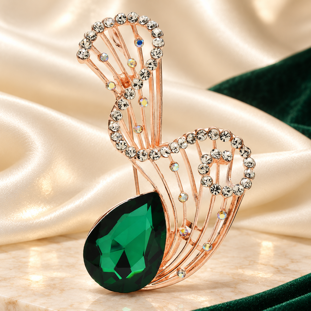 Looped Rhinestone Frame with Faceted Teardrop Brooch — styled background