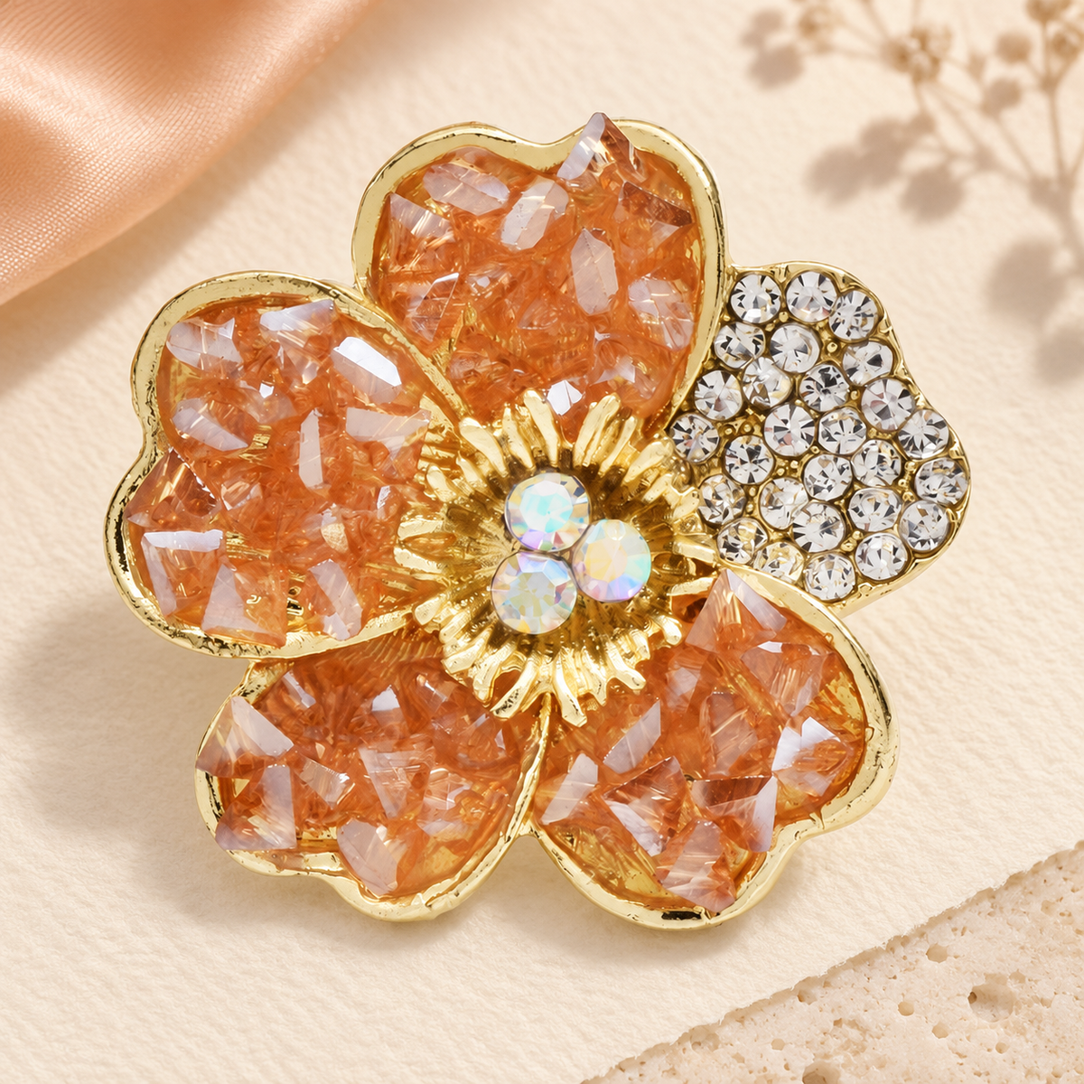 Textured Faceted Blossom with Rhinestone Petal Brooch — styled background