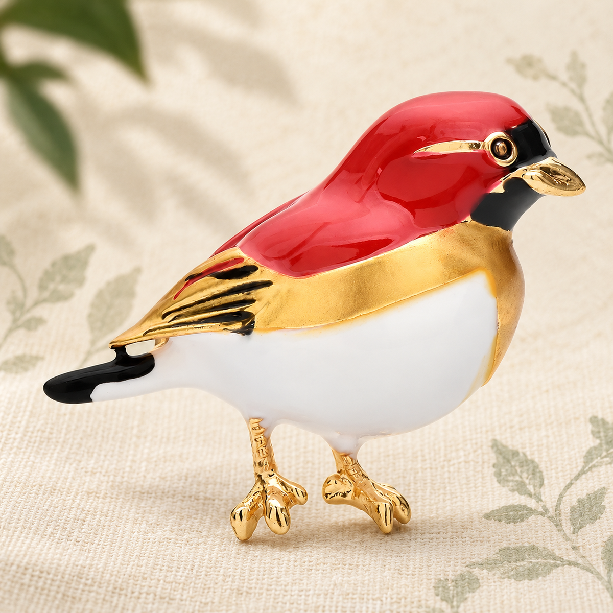 Red and Yellow Enamel Songbird Brooch — styled background