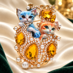 Royal Enamel Cat Pair with Faceted Accents Brooch — styled background