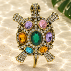 Vintage Jeweled Turtle with Oval Shell Brooch — styled background