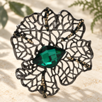 Openwork Flower with Faceted Oval Center Brooch — styled background