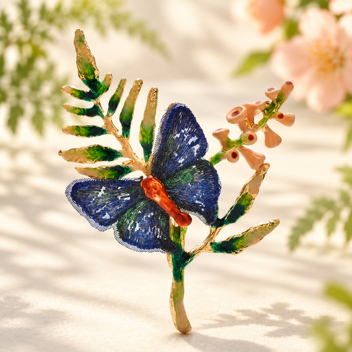 Enamel Butterfly on Leafy Flower Sprig Brooch — styled background