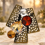 Geometric Openwork Tree with Faceted Accents Brooch — styled background