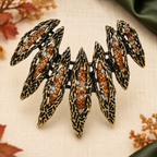 Rhinestone Feather Wing Fan Brooch — styled background