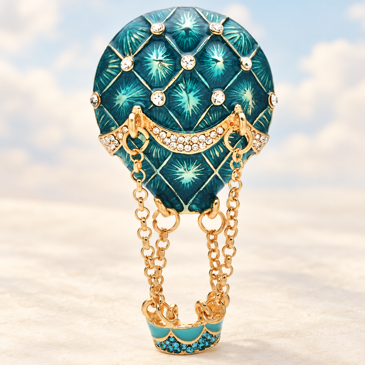 Blue Enamel Hot Air Balloon with Chain Basket Brooch — styled background