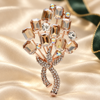 Faceted Flower Bouquet with Rhinestone Bow Brooch — styled background