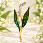 Enamel Lily Sprig with Green Leaves Brooch — styled background