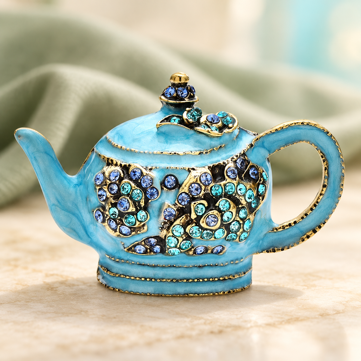 Ornate Enamel Teapot Brooch — styled background