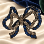 Double-Layer Rhinestone Bow Brooch — styled background