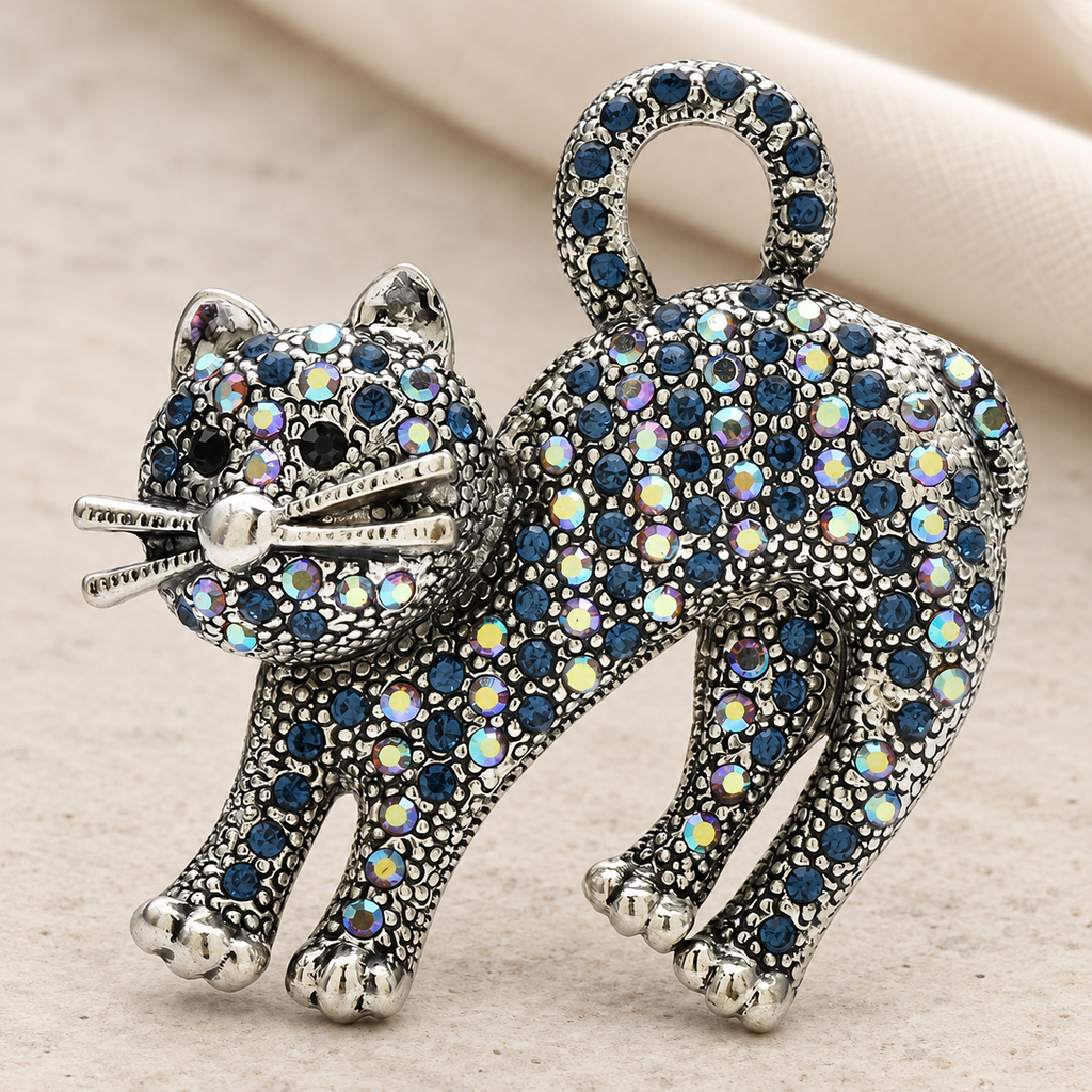 Arched-Back Rhinestone Cat Brooch — styled background