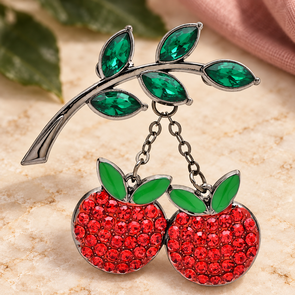 Rhinestone Cherries on Leafy Branch Brooch — styled background