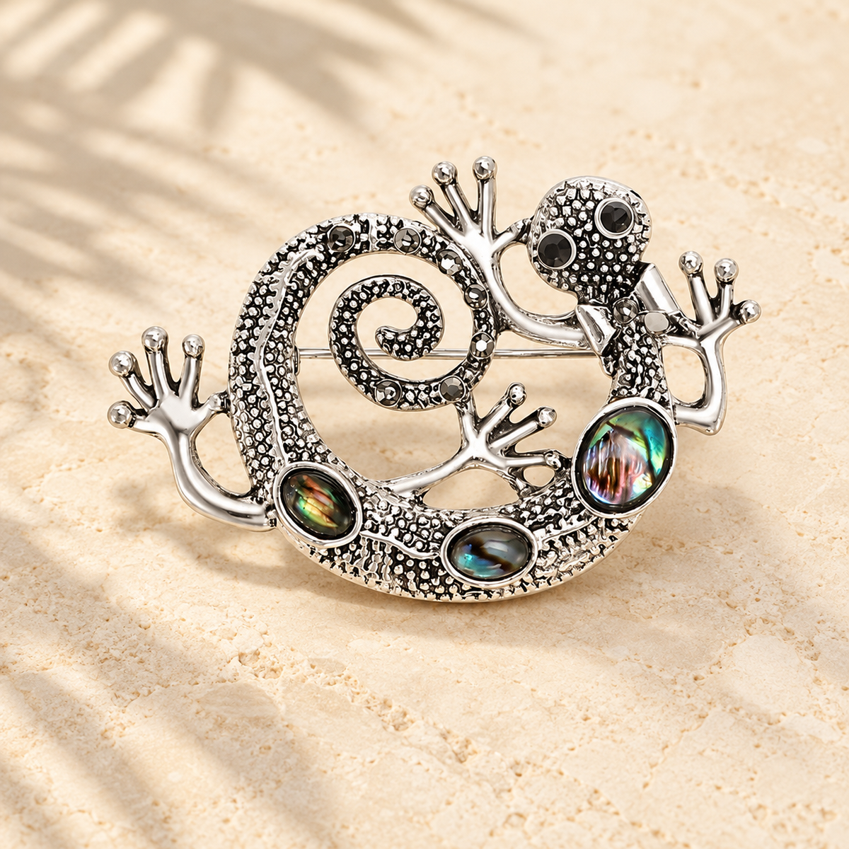 Curled Gecko with Iridescent Inlays Brooch — styled background