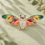 Patterned Enamel Winged Insect Brooch — styled background