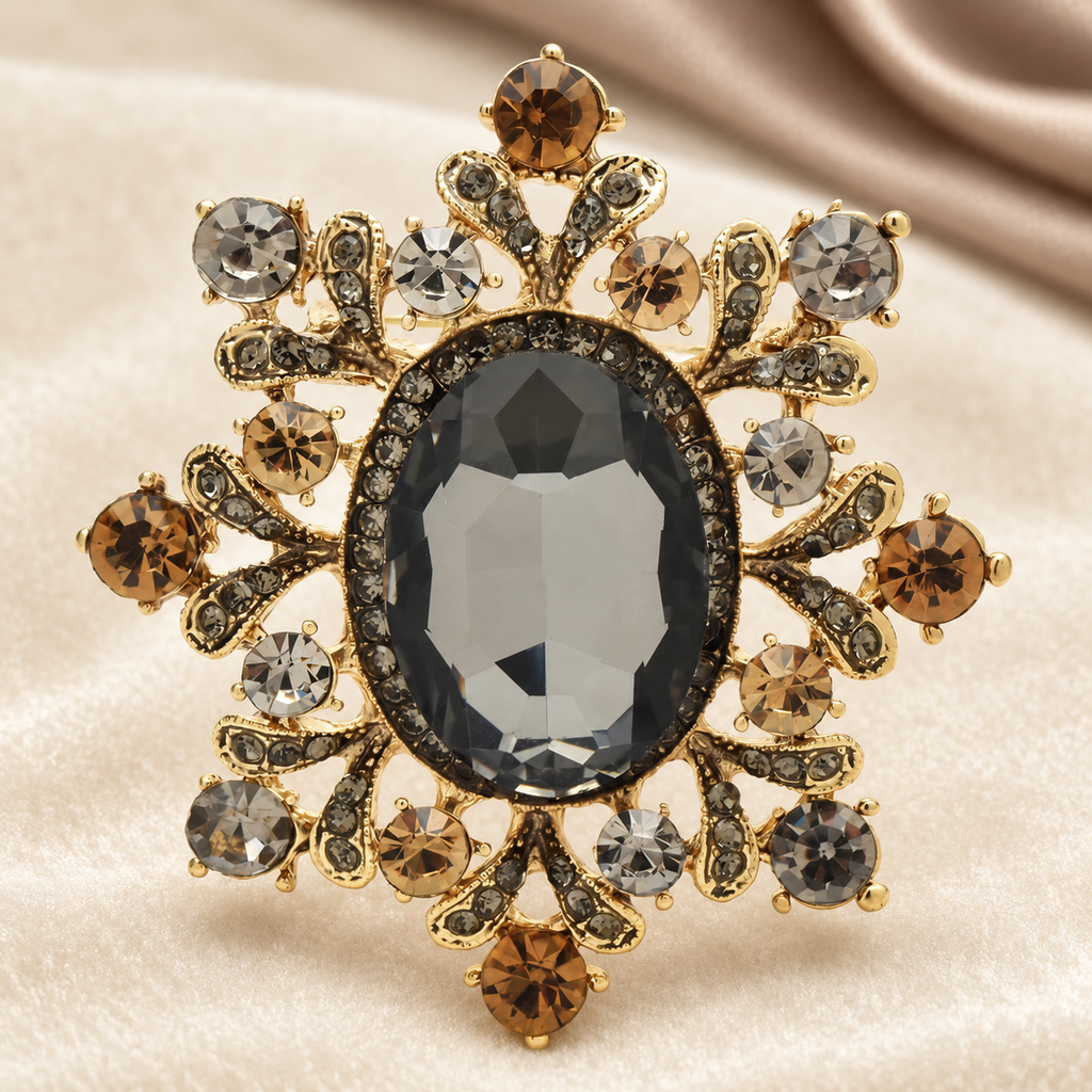 Ornate Oval Faceted Stone Brooch — styled background