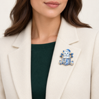 Christmas Kitten in Gift Box Brooch worn on an ivory blazer