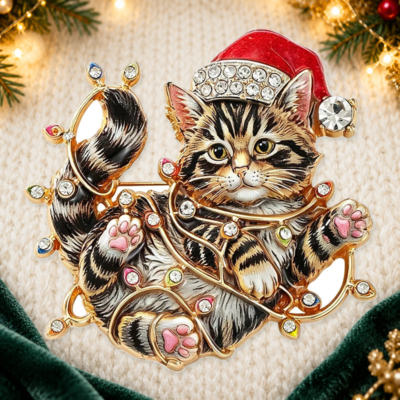 Christmas Kitten Tangled in Fairy Lights Brooch styled ivory evergreen and gold background