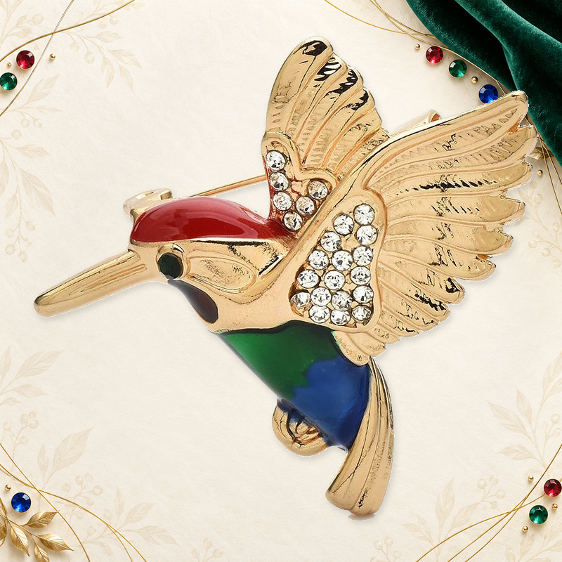 Colorful Flying Bird with Sparkling Wings Brooch on an ivory, evergreen and gold gallery background