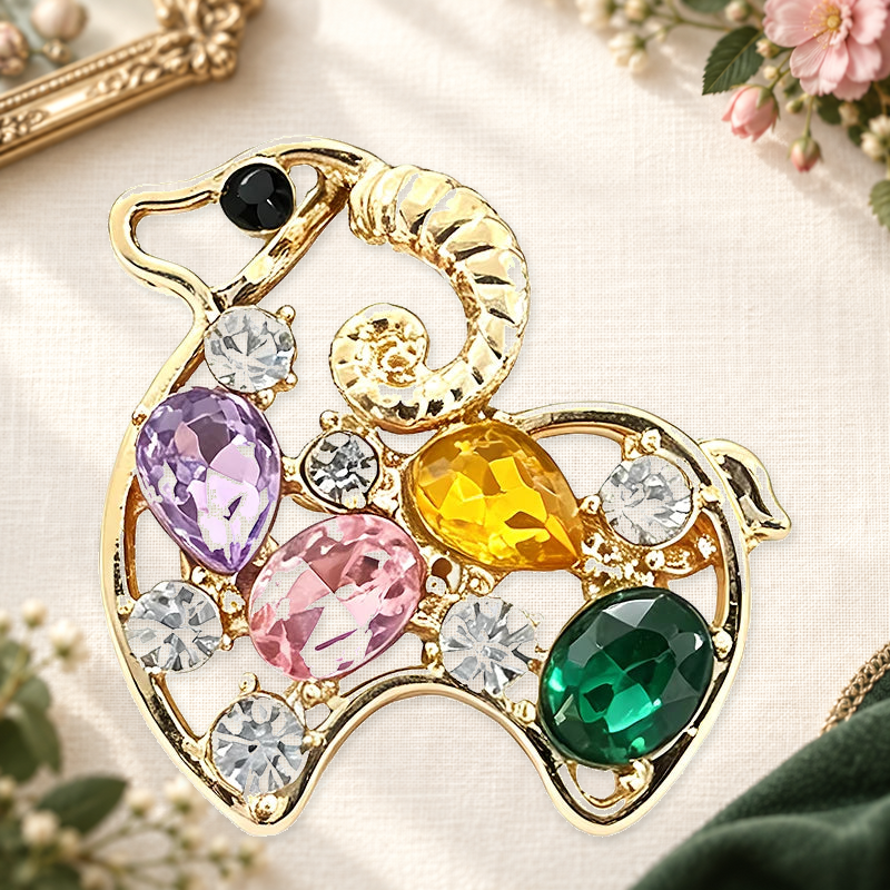 Colorful Sparkle Curled Horn Goat Brooch on a complementary display background