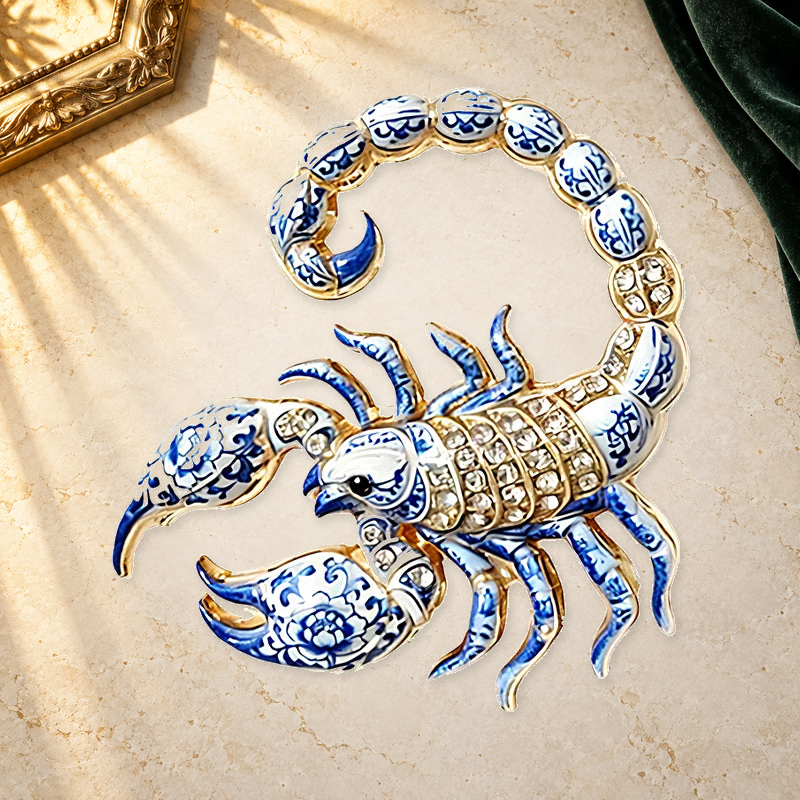 Curled Tail Scorpio Scorpion Brooch on a complementary display background