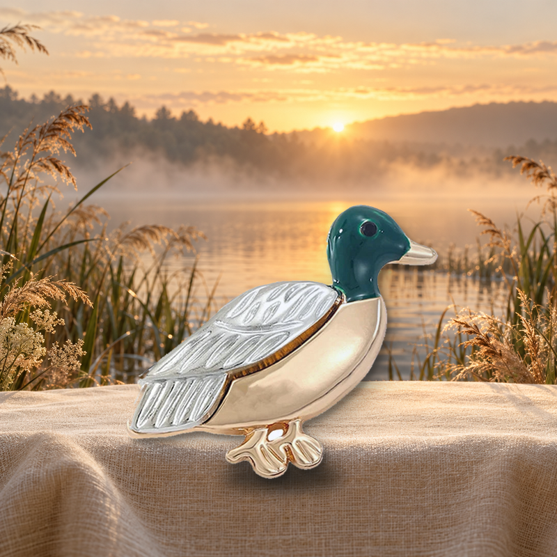 Duck with Engraved Wing Brooch styled in a thematic scene