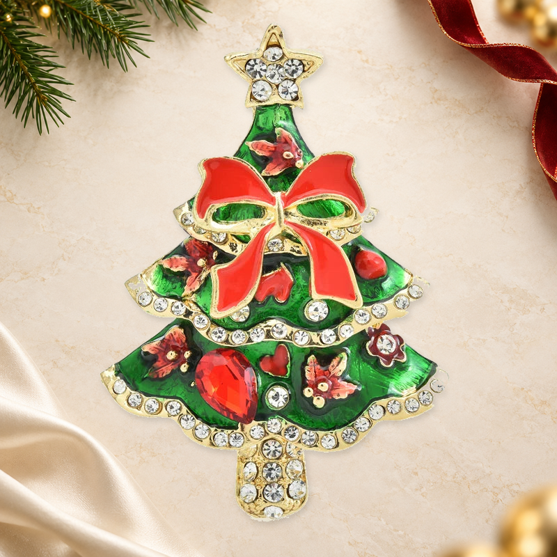 Enamel Christmas Tree with Bow Brooch on an elegant festive ivory, evergreen and gold background