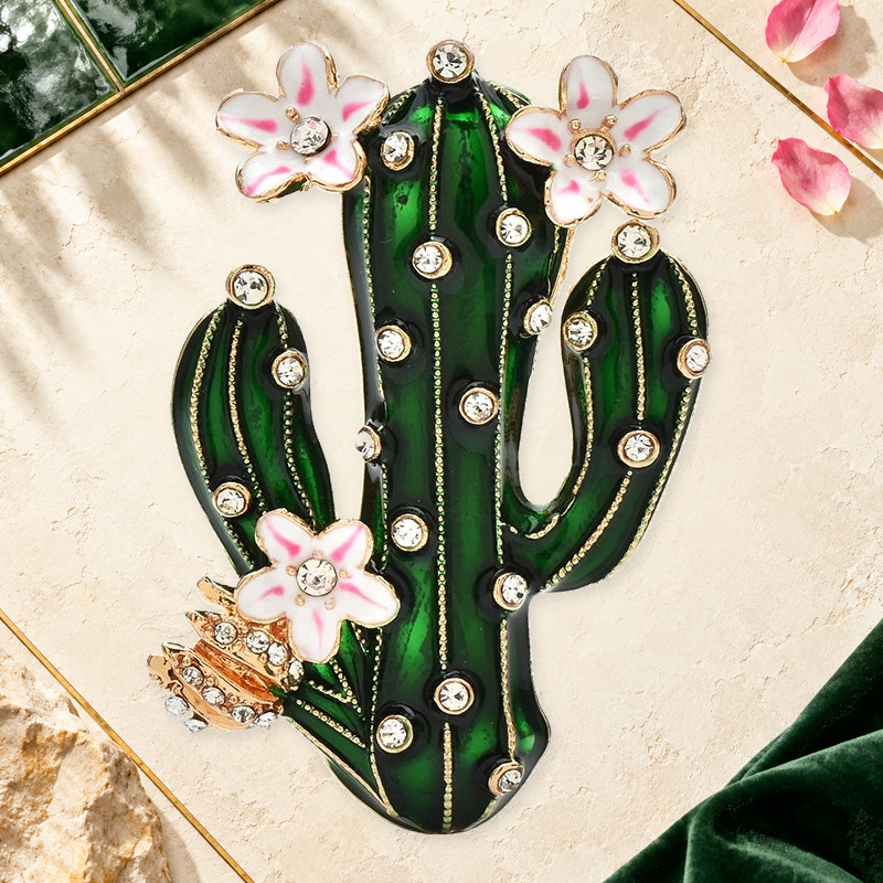 Flowering Enamel Cactus Brooch on an elegant ivory, evergreen and gold background