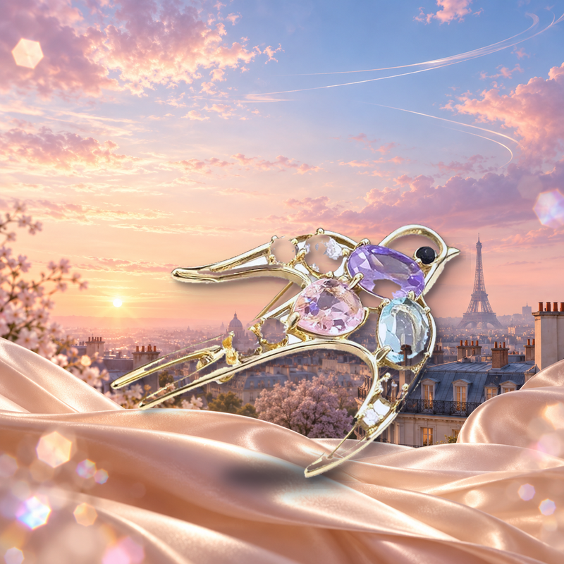 Flying Swallow with Pastel Faceted Accents Brooch styled in a thematic scene