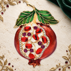 Jeweled Enamel Pomegranate Brooch on an ivory, evergreen and gold gallery background